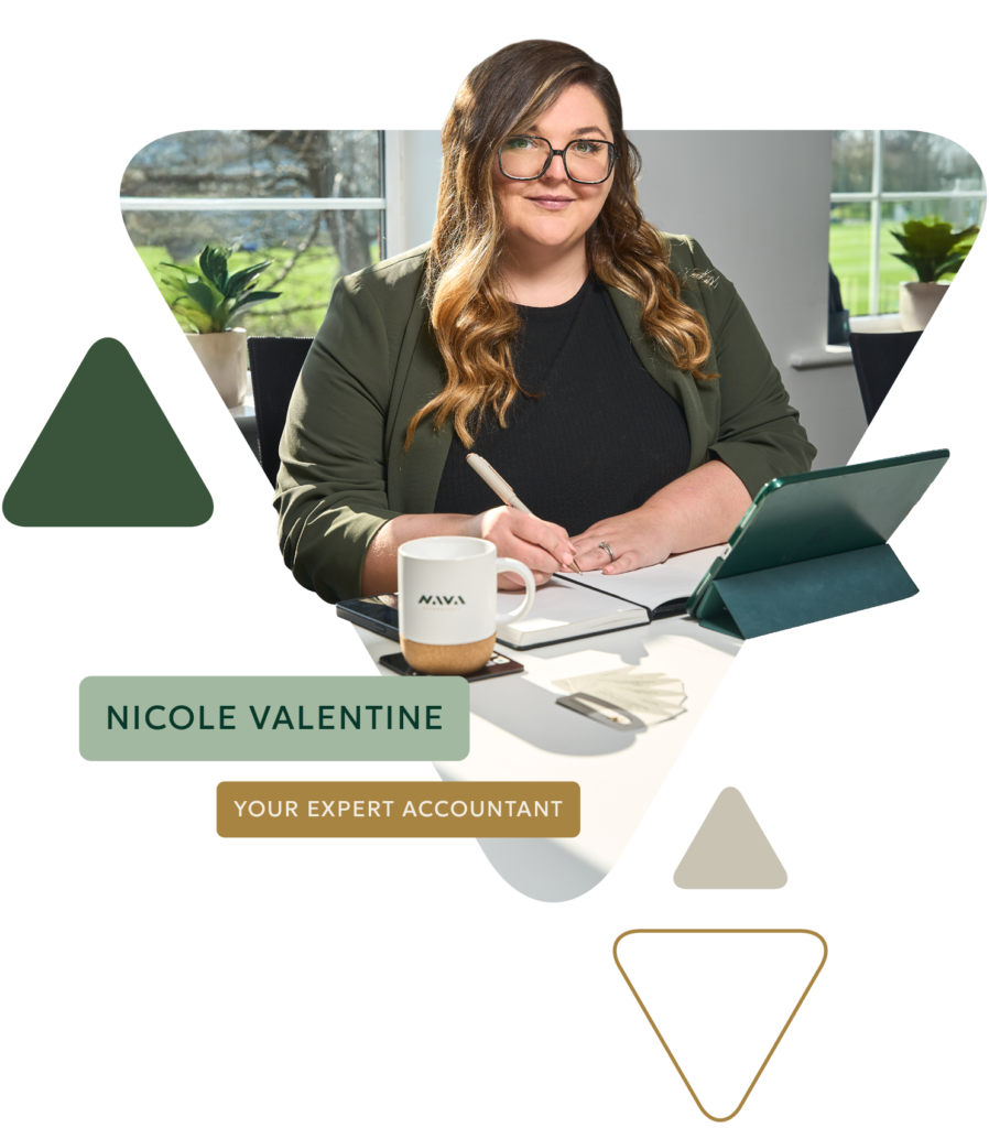 Accountant writing at desk with tablet and coffee